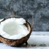 Discover the benefits of coconut candle wax as we have a coconut cut in half lying on a surface