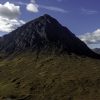 The mountain Buachaille Etive Mòr in Glen Coe appears under a blue sky