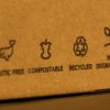 a cardboard box with the words 'plastic free', 'compostable', bio degradable' and recycled' on it.