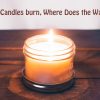 A lit candle in a jar sits on top of a wooden table. Above the candle, there is some text written that says "When Candles burn, Where Does the Wax Go?"