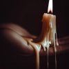 A candle is lit on a persons hand with wax melting down the sides onto a hand. Does candle wax burn skin? We find out