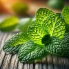 Fresh peppermint leaves are displayed on a rustic wooden surface, showcasing vibrant green colours and natural texture. Perfect for illustrating 'What does peppermint smell like?'