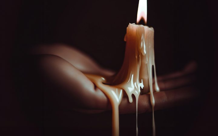 A candle is lit on a persons hand with wax melting down the sides onto a hand. Does candle wax burn skin? We find out