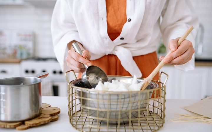 Person Preparing Soy Wax For Candle