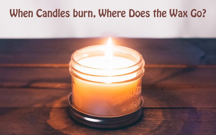 A lit candle in a jar sits on top of a wooden table. Above the candle, there is some text written that says "When Candles burn, Where Does the Wax Go?"