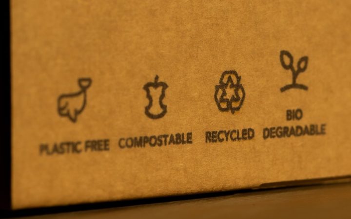 a cardboard box with the words 'plastic free', 'compostable', bio degradable' and recycled' on it.