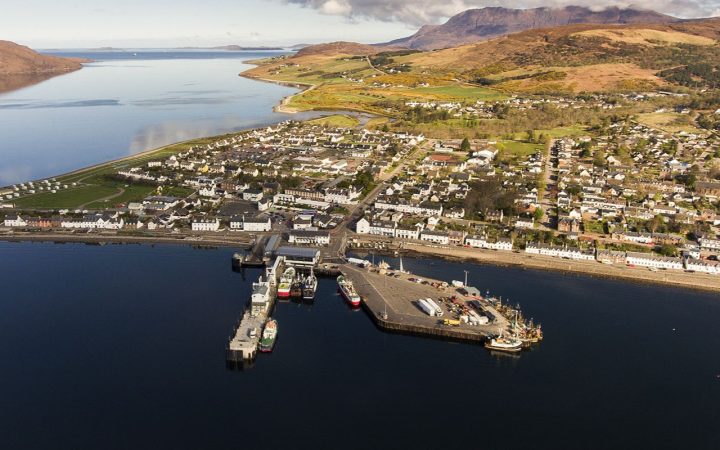 Aerial view of Ullapool and Loch Broom over looking the main part of the village and the harbour